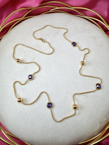 Collana lunga con punti luce viola e palline