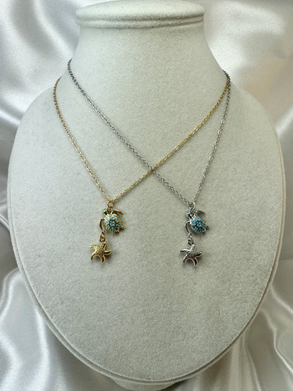 Collana con tartaruga e stella marina pendente