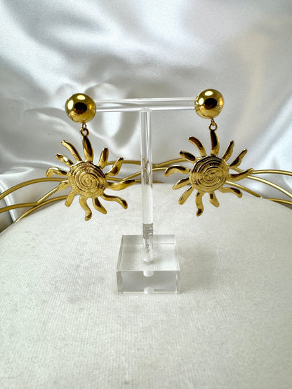 Orecchini con sole pendente