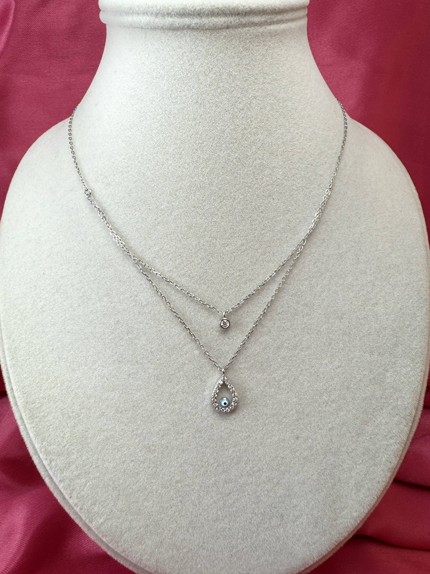 Collana doppio filo con goccia, occhio turco e punto luce