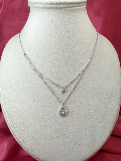 Collana doppio filo con goccia, occhio turco e punto luce