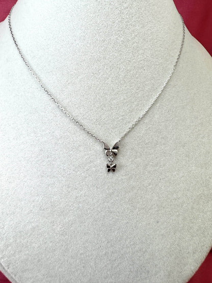 Collana con doppia farfalla e punto luce