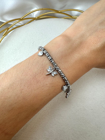 Bracciale con pepite lavorate, libellula, farfalla e fiore