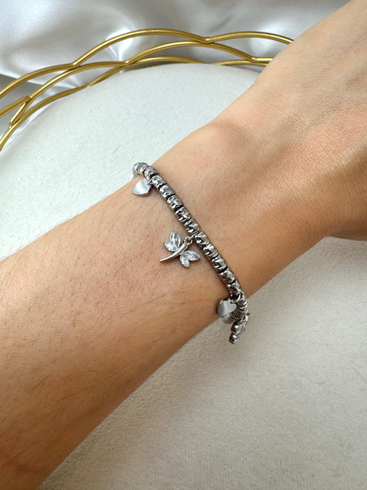 Bracciale con pepite lavorate, libellula, farfalla e fiore