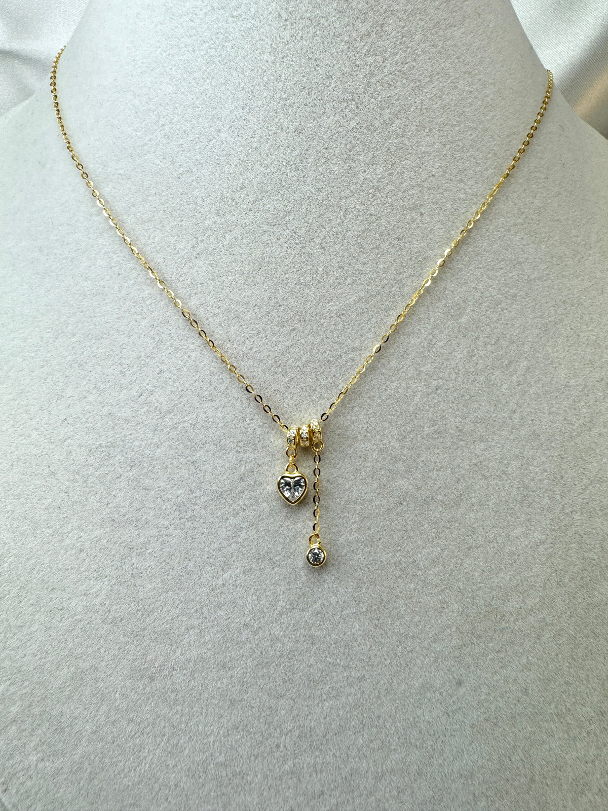 Collana con cuore e punto luce pendenti