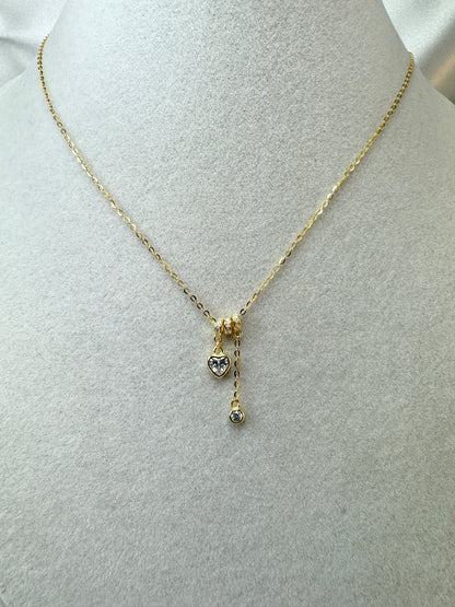 Collana con cuore e punto luce pendenti