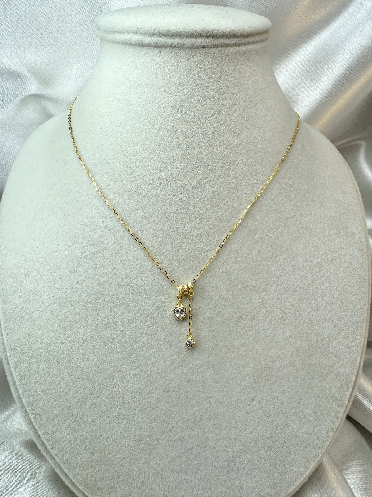 Collana con cuore e punto luce pendenti