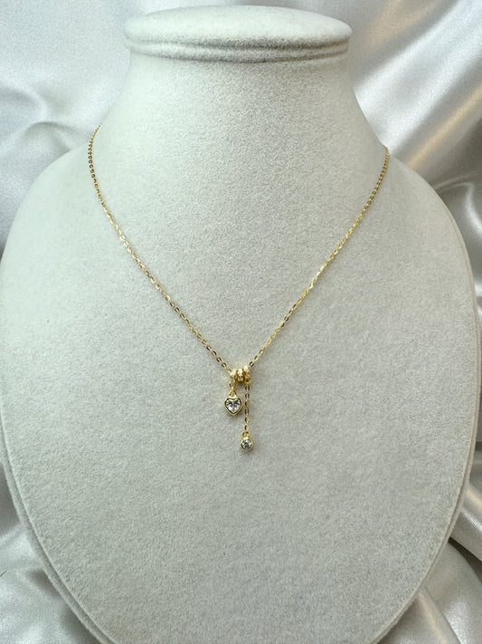 Collana con cuore e punto luce pendenti