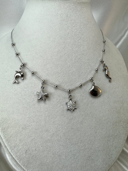 Collana con ciondoli marini bombati