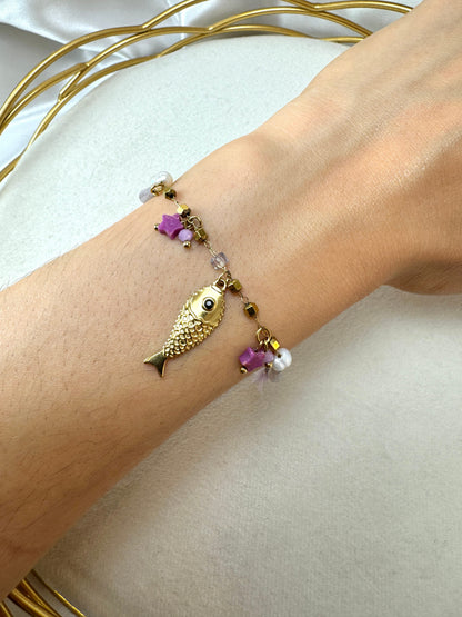 Bracciale con pesci e nappine