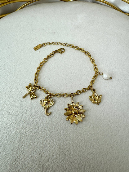 Bracciale con fiore, libellula, elefante e ciondoli