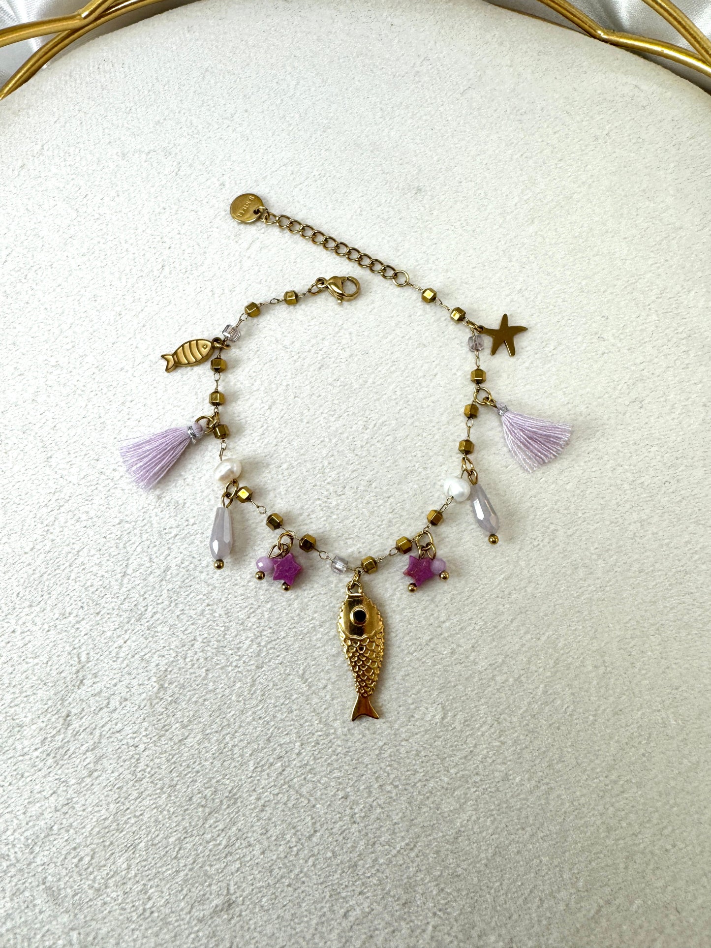 Bracciale con pesci e nappine