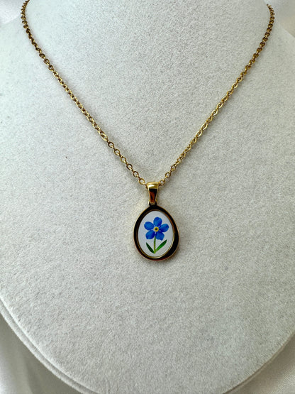 Collana cabochon con fiore blu