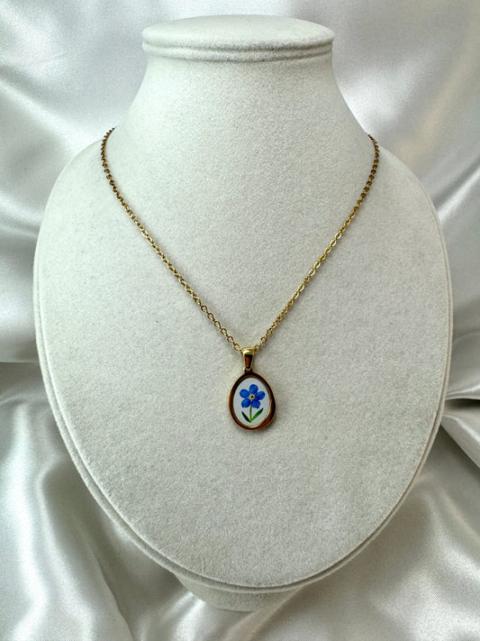 Collana cabochon con fiore blu