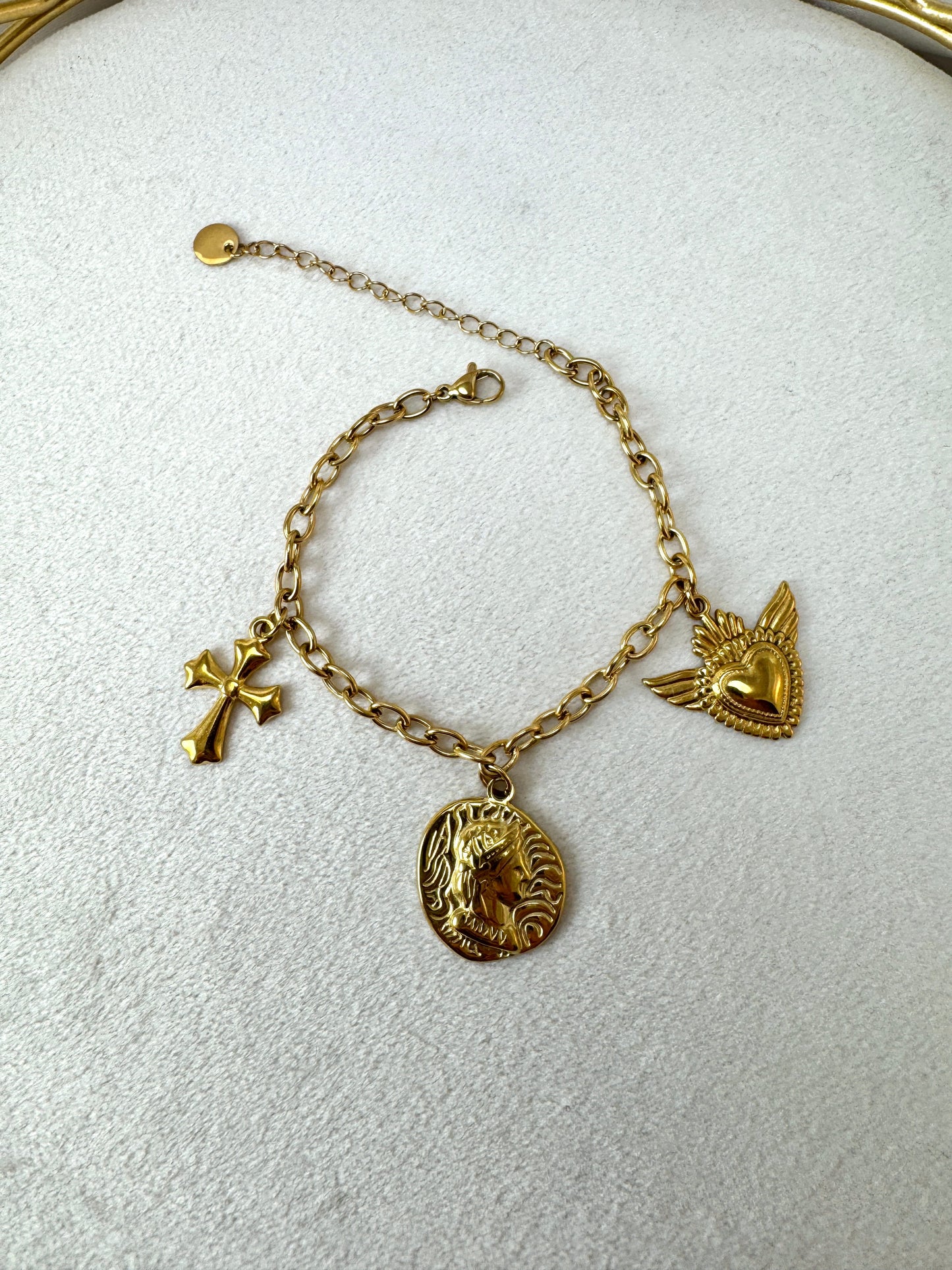 Bracciale con monera, croce e cuore sacro