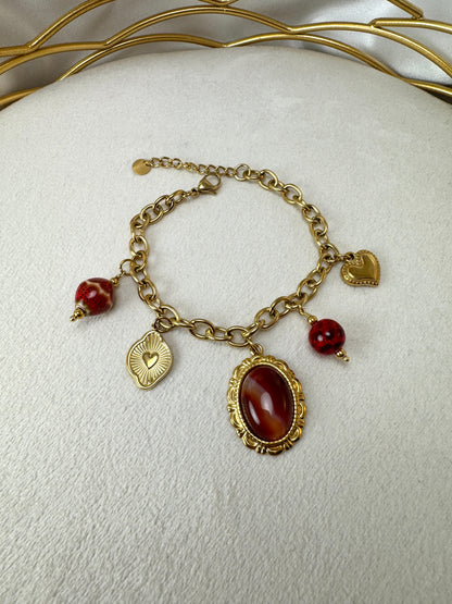 Bracciale con ovale colorato e ciondoli