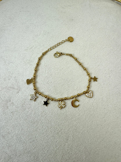 Bracciale con micro palline e ciondoli