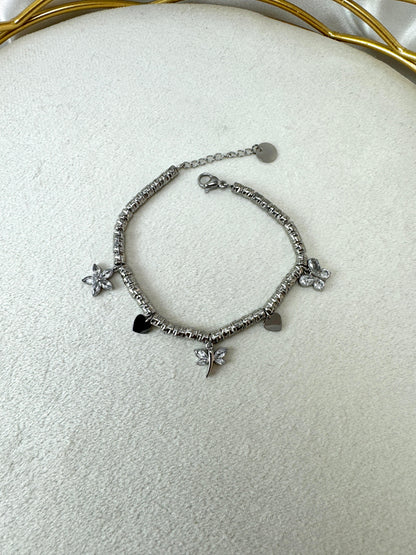 Bracciale con pepite lavorate, libellula, farfalla e fiore